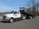 2005 FORD Model F-650XLT, Super Duty Pro Loader Extended Cab Single Axle Rollback Truck